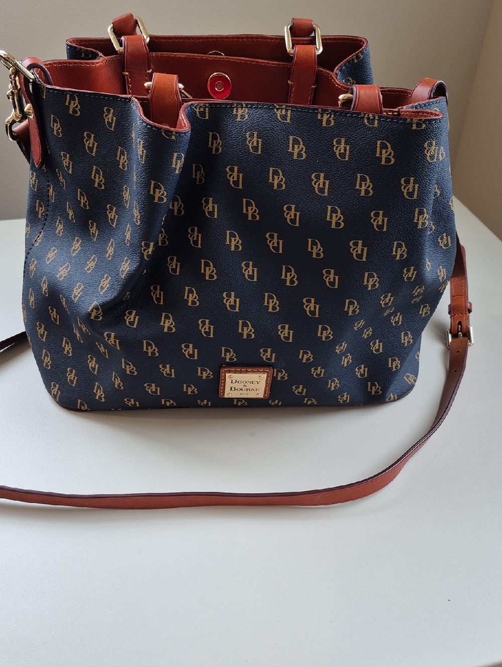 Dooney & Bourke Navy Logo Bucket Bag with Brown Leather Trim and Strap